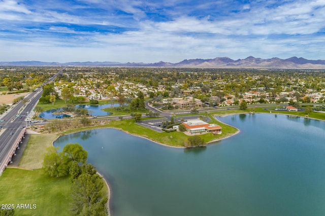 birds eye view of property featuring a water and mountain view