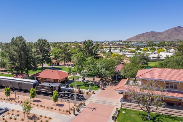 birds eye view of property featuring a mountain view