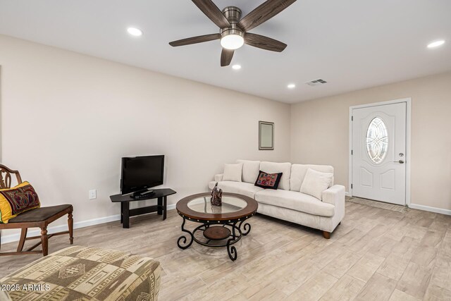 living area featuring recessed lighting, visible vents, light wood-style flooring, and a ceiling fan