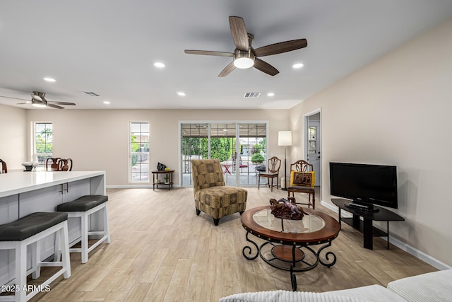 living room featuring recessed lighting, visible vents, light wood finished floors, and ceiling fan