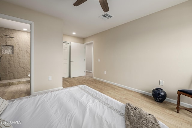 unfurnished bedroom featuring visible vents, baseboards, recessed lighting, ensuite bathroom, and wood finished floors