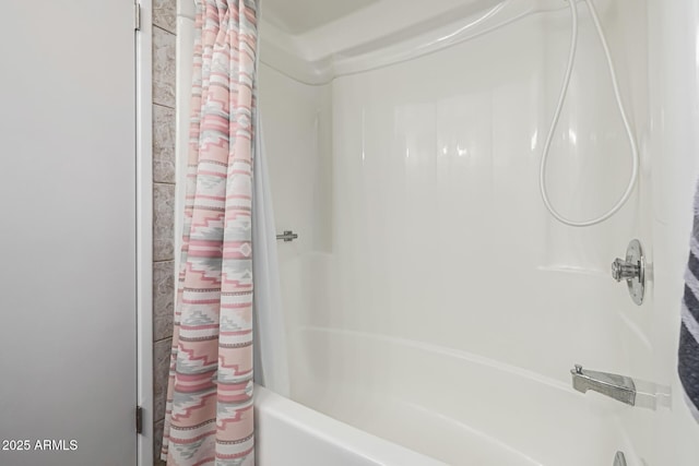 bathroom featuring shower / bath combination with curtain