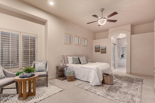 bedroom featuring carpet flooring, connected bathroom, and ceiling fan