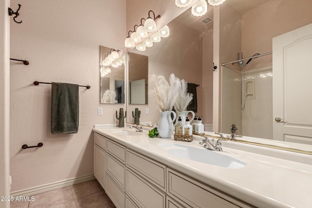 bathroom featuring tile patterned floors, shower / bathing tub combination, and vanity