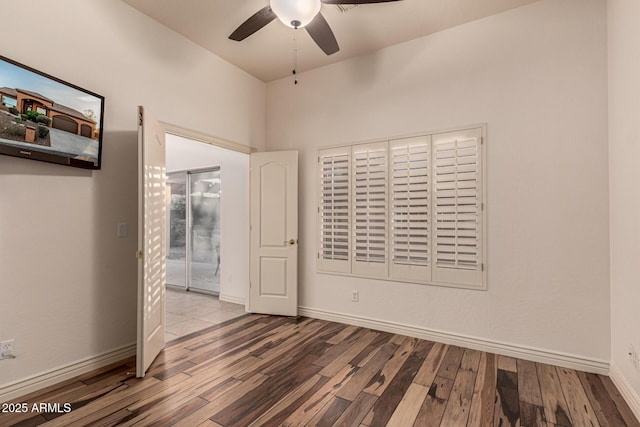 empty room featuring ceiling fan and light wood-type flooring