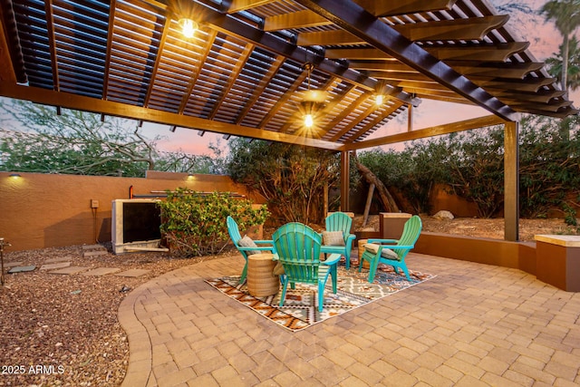 patio terrace at dusk with a pergola