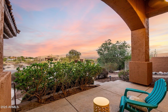 view of patio terrace at dusk