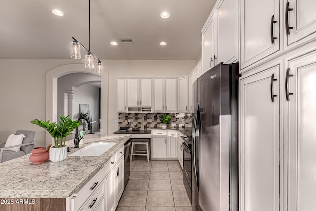 kitchen featuring white cabinetry, dishwasher, sink, a center island, and refrigerator