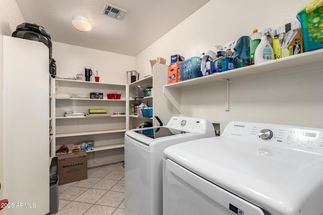 washroom featuring washer and clothes dryer