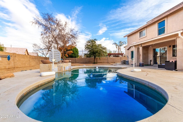 view of swimming pool featuring a patio area