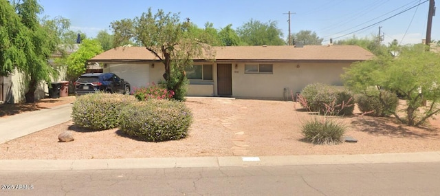 8146 E Pine Dr, Scottsdale, AZ 85257 - ranch-style house with a garage and stucco siding