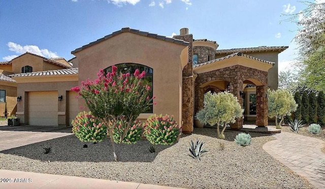 mediterranean / spanish house featuring a garage