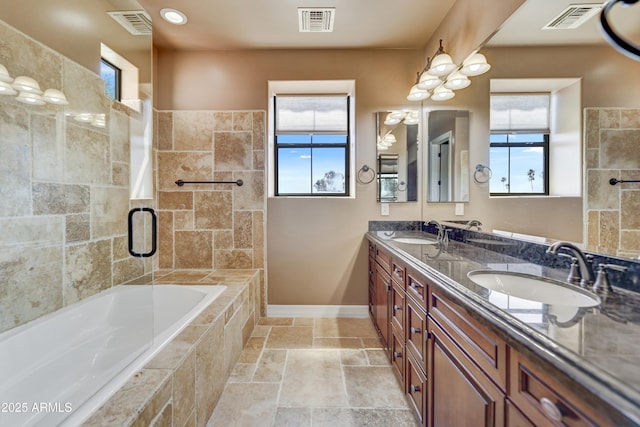 bathroom featuring vanity and separate shower and tub