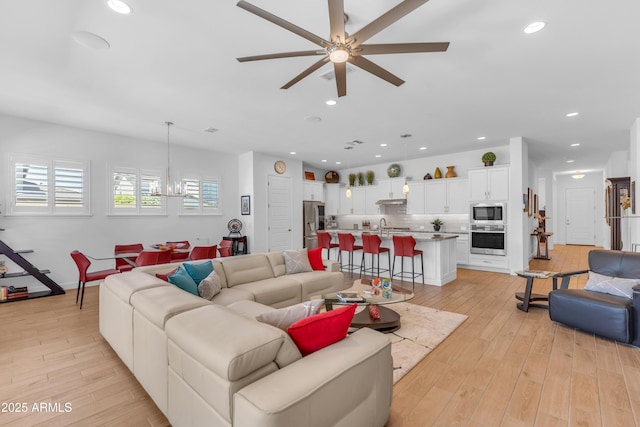 5637 S Parrish, Mesa, AZ 85212 - living area featuring ceiling fan, light wood-style floors, recessed lighting, and a chandelier
