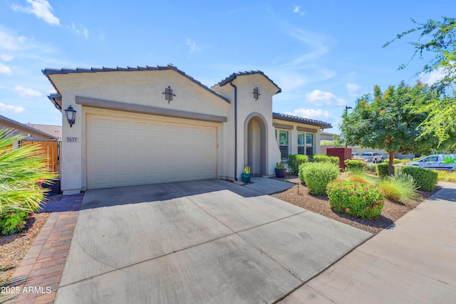 5637 S Parrish, Mesa, AZ 85212 - mediterranean / spanish-style house featuring stucco siding, a garage, driveway, and a tile roof