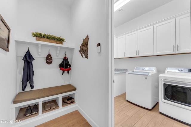 5637 S Parrish, Mesa, AZ 85212 - laundry room with cabinet space, washer and clothes dryer, and light wood-style floors