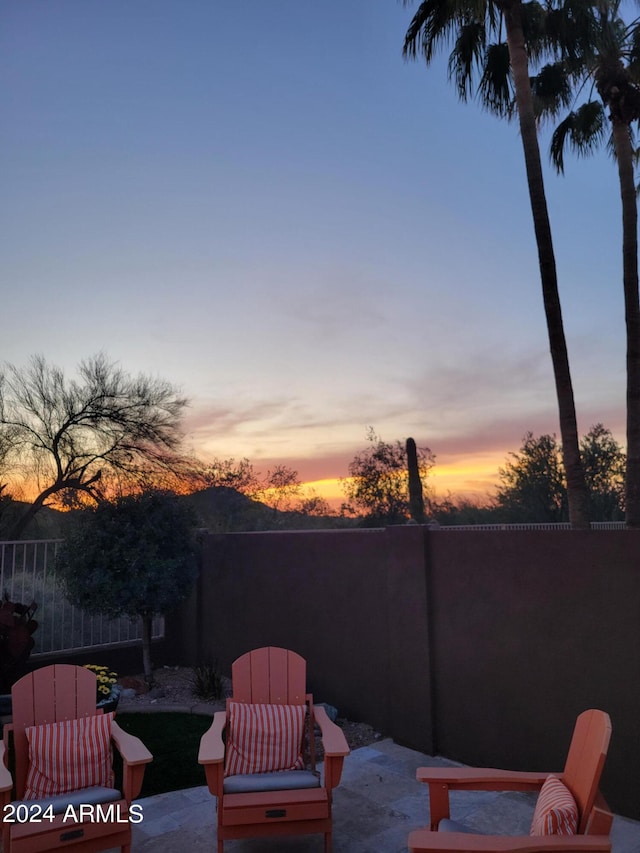 view of patio terrace at dusk