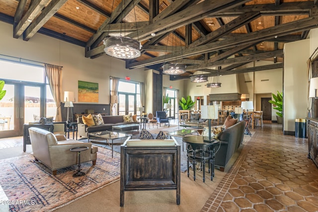 living room with high vaulted ceiling, wood ceiling, and beamed ceiling