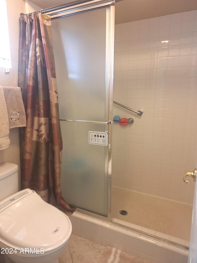 bathroom with tile patterned floors and curtained shower