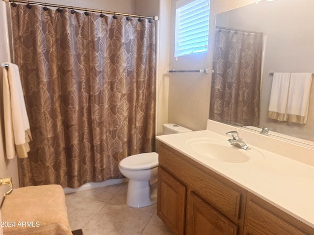 bathroom featuring tile patterned floors, vanity, and toilet