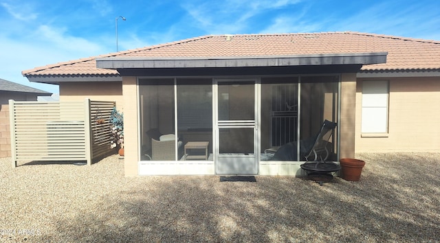 back of house with a sunroom