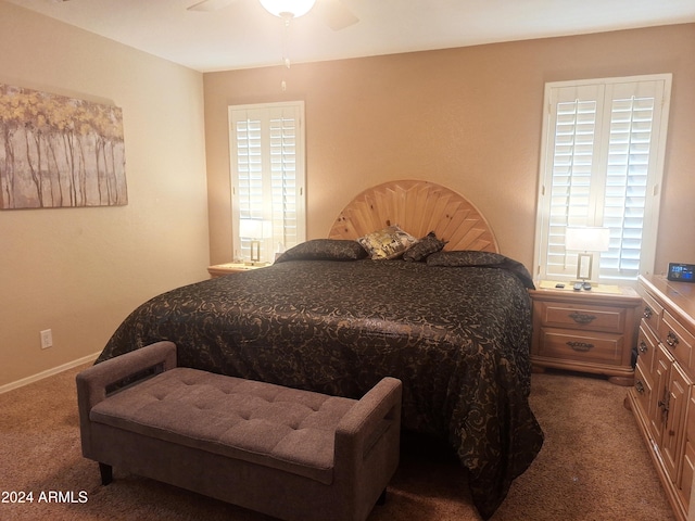 carpeted bedroom with ceiling fan