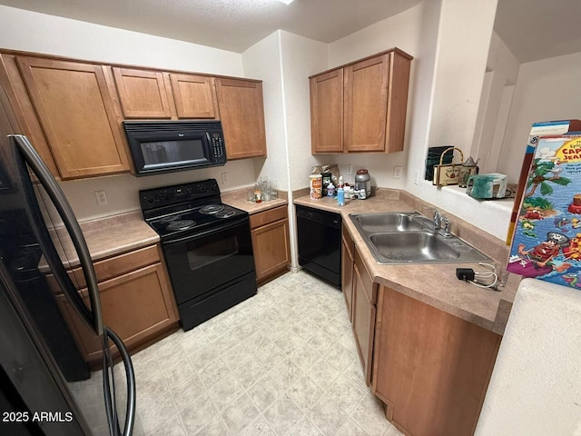 kitchen featuring black appliances and sink