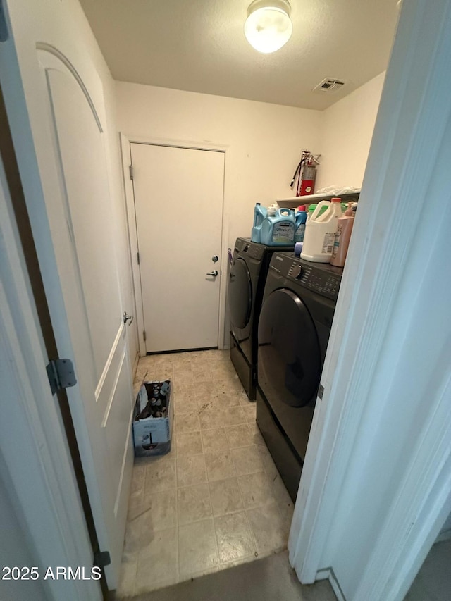 laundry room featuring independent washer and dryer