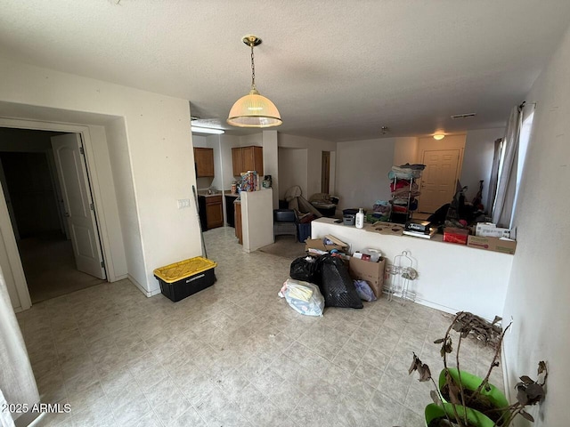 living room with a textured ceiling