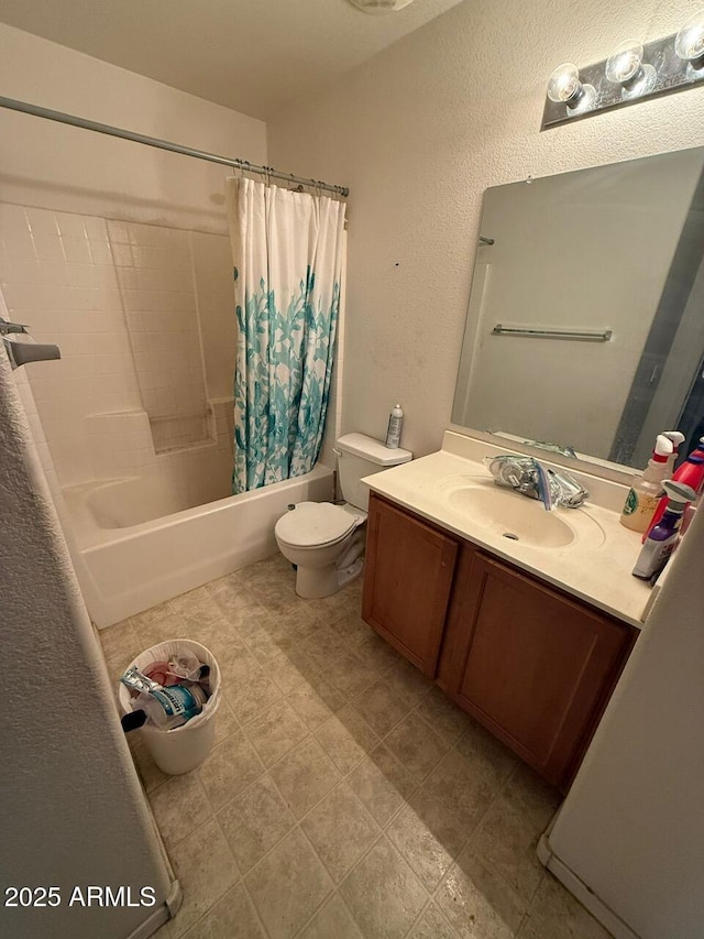 full bathroom featuring shower / bathtub combination with curtain, vanity, and toilet