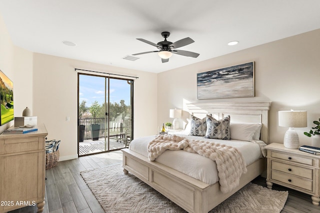 bedroom featuring dark hardwood / wood-style floors, access to exterior, and ceiling fan