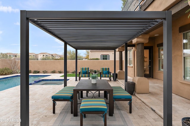 view of patio / terrace featuring a swimming pool with hot tub