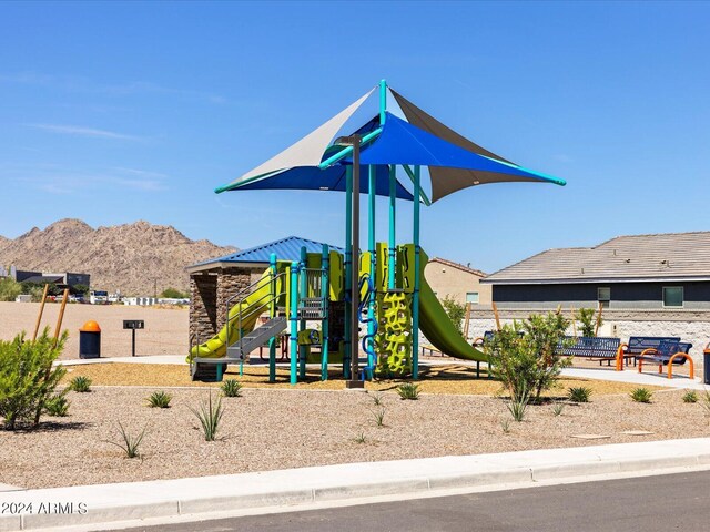 view of playground featuring a mountain view