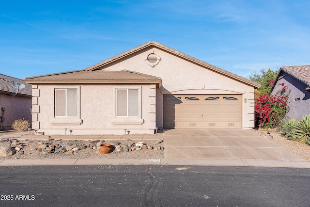 single story home with driveway, an attached garage, a tiled roof, and stucco siding