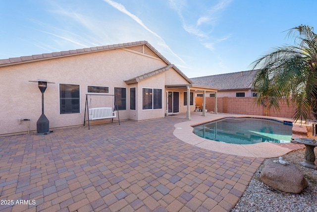 view of pool with fence, a fenced in pool, and a patio