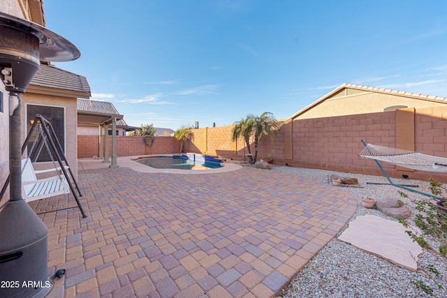 view of patio featuring a fenced backyard and a fenced in pool