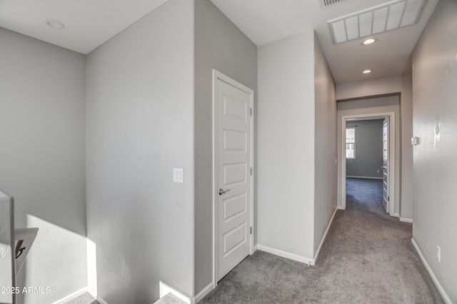 hallway featuring light carpet