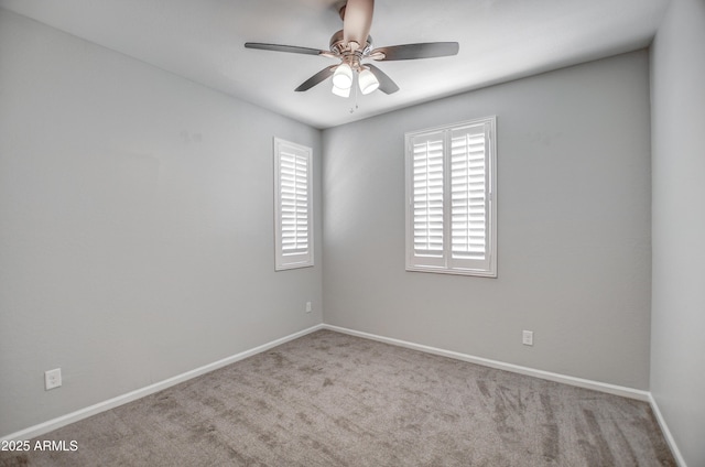 empty room featuring light carpet and ceiling fan