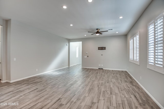 unfurnished living room with ceiling fan and light hardwood / wood-style floors