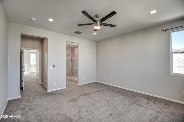 unfurnished bedroom featuring ceiling fan, connected bathroom, and light colored carpet