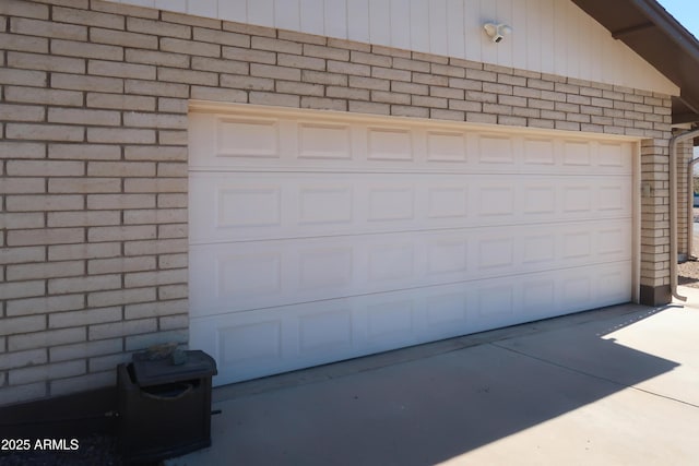 garage with concrete driveway