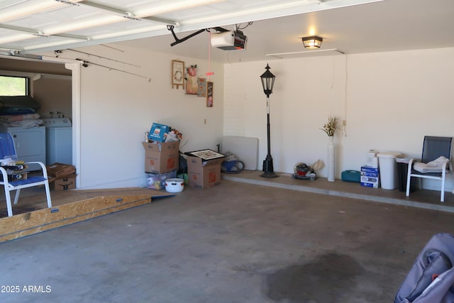 garage featuring a garage door opener and washer and clothes dryer