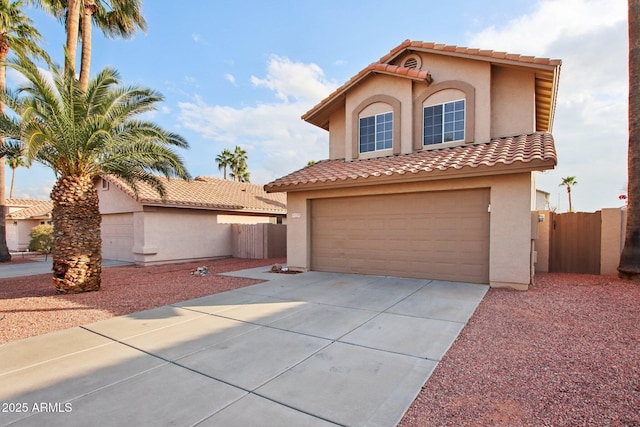 mediterranean / spanish-style home featuring a garage