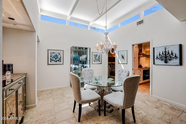 361 E Palm Ln, Phoenix, AZ 85004 - dining room with a chandelier, a high ceiling, plenty of natural light, and beam ceiling