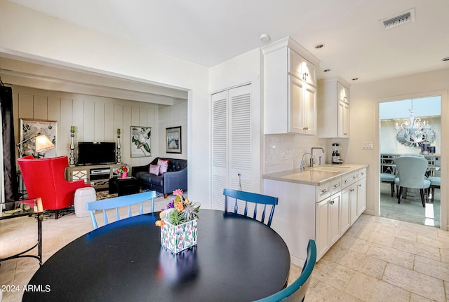 361 E Palm Ln, Phoenix, AZ 85004 - dining room with a chandelier and stone tile flooring