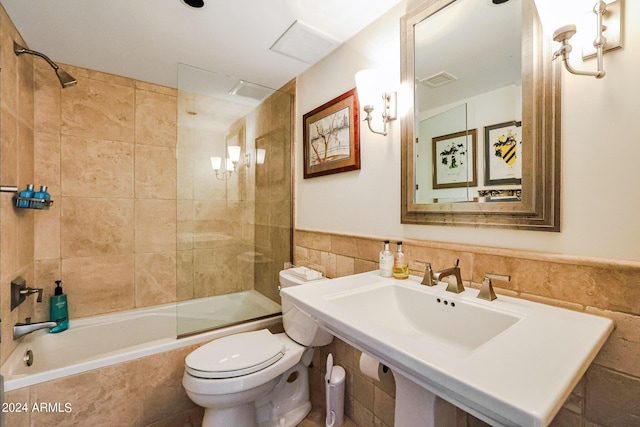 361 E Palm Ln, Phoenix, AZ 85004 - bathroom featuring tile walls and tiled shower / bath