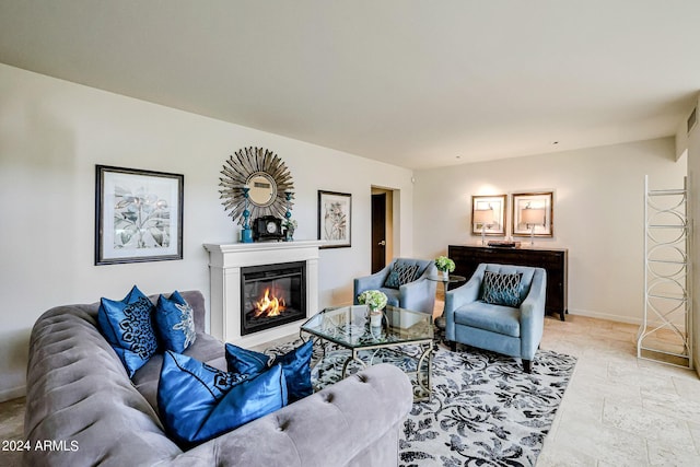 361 E Palm Ln, Phoenix, AZ 85004 - living area with a glass covered fireplace and stone tile floors