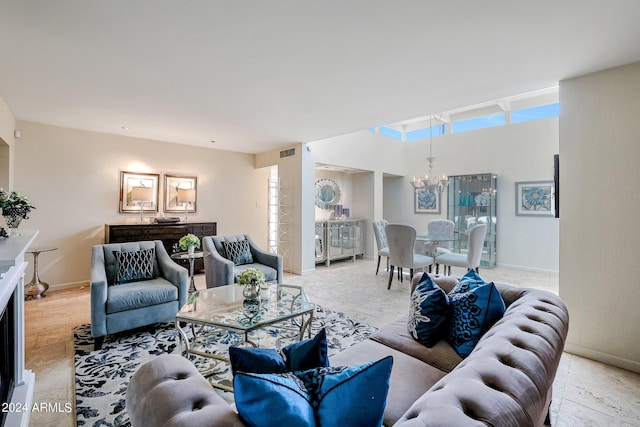 361 E Palm Ln, Phoenix, AZ 85004 - living room featuring a chandelier and baseboards