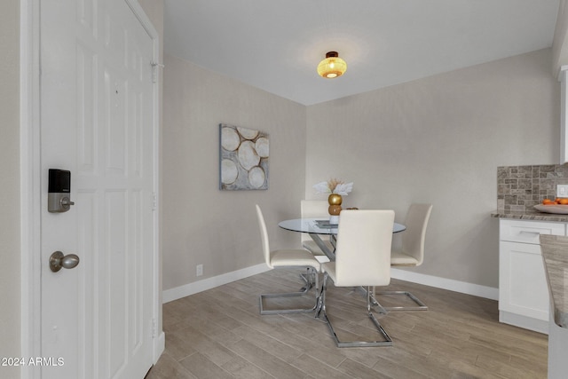 dining room with light hardwood / wood-style floors