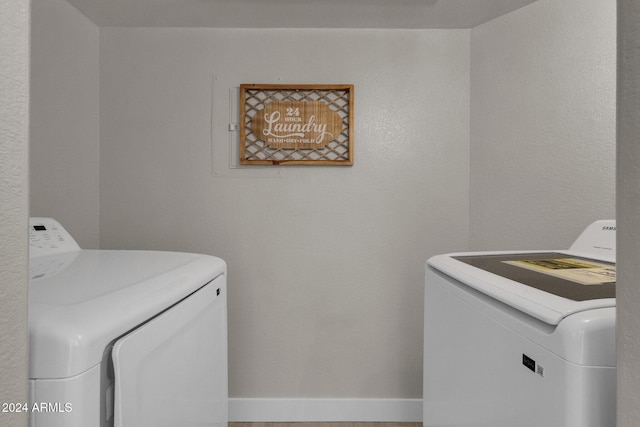 laundry room featuring washing machine and dryer